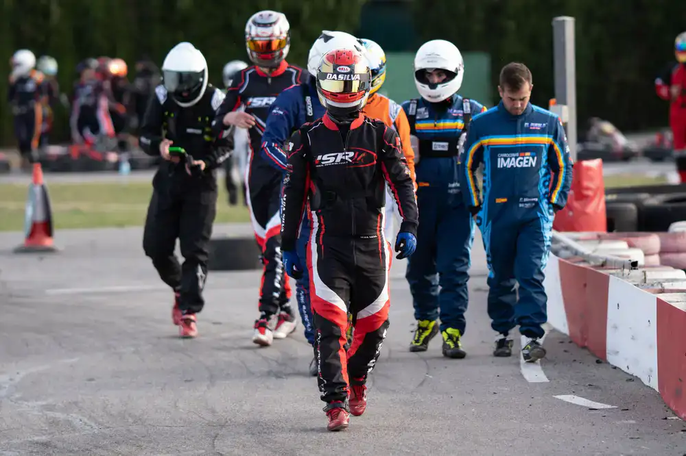 Group of racers cheering with helmets