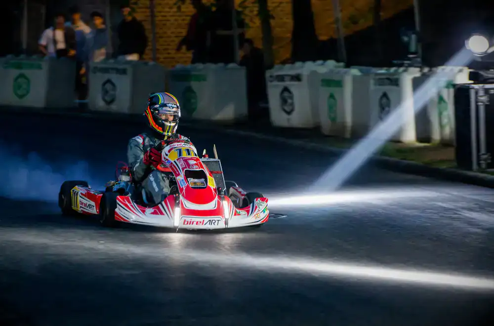 Electric kart accelerating rapidly out of a sharp track corner